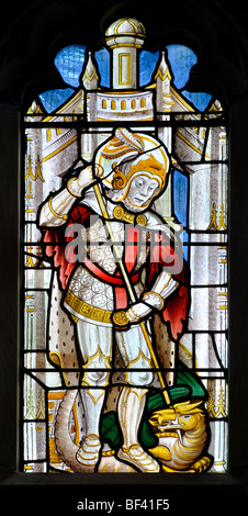 St. George and the Dragon stained glass in St. Michael`s Church, Baddesley Clinton, Warwickshire, England, UK Stock Photo